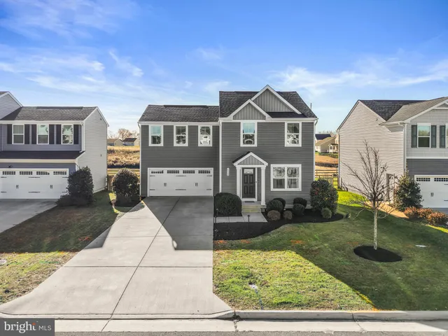 a view of a swimming pool with a yard