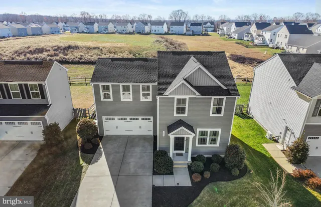 a view of a backyard with swimming pool