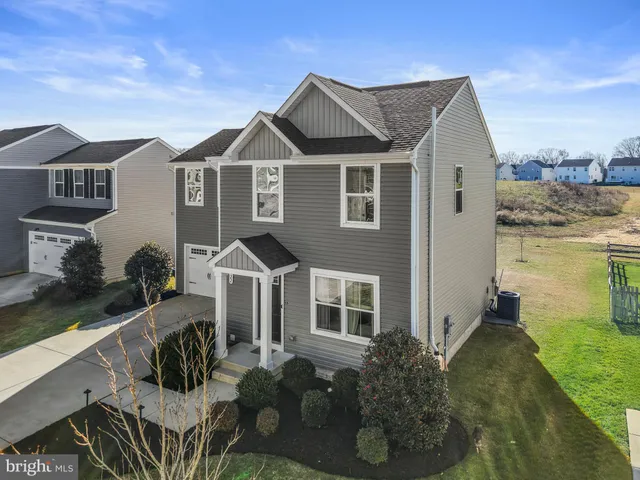 a view of a park with swings on a table and chairs