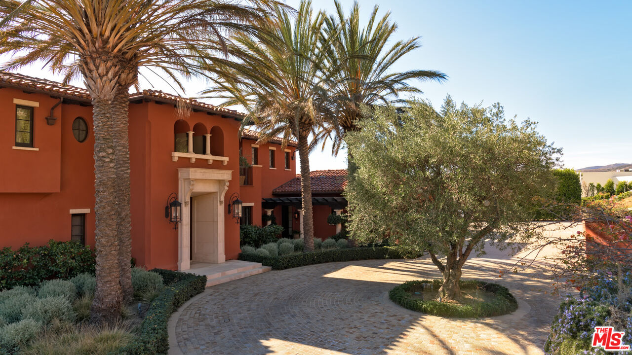 6093 Murphy Way Malibu, CA 90265 - Photo 8 of 52 a front view of a house with a yard