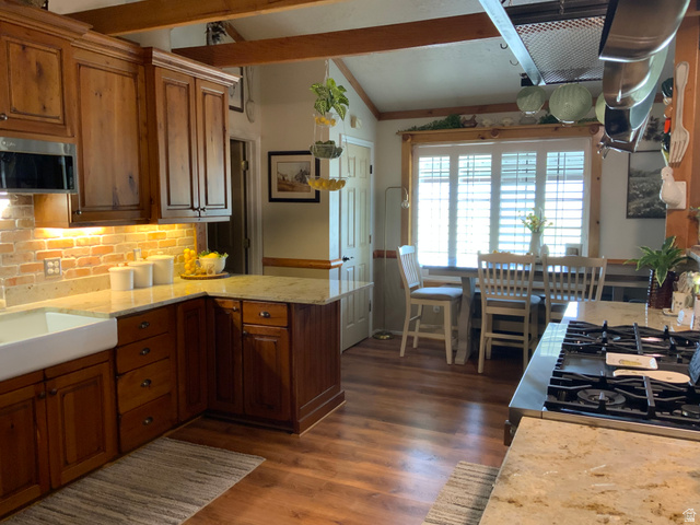 1061 Copper Street Stockton, UT 84071 - Photo 7 of 43 Kitchen with wood-finish flooring, exposed ceiling beams, and a farmhouse sink