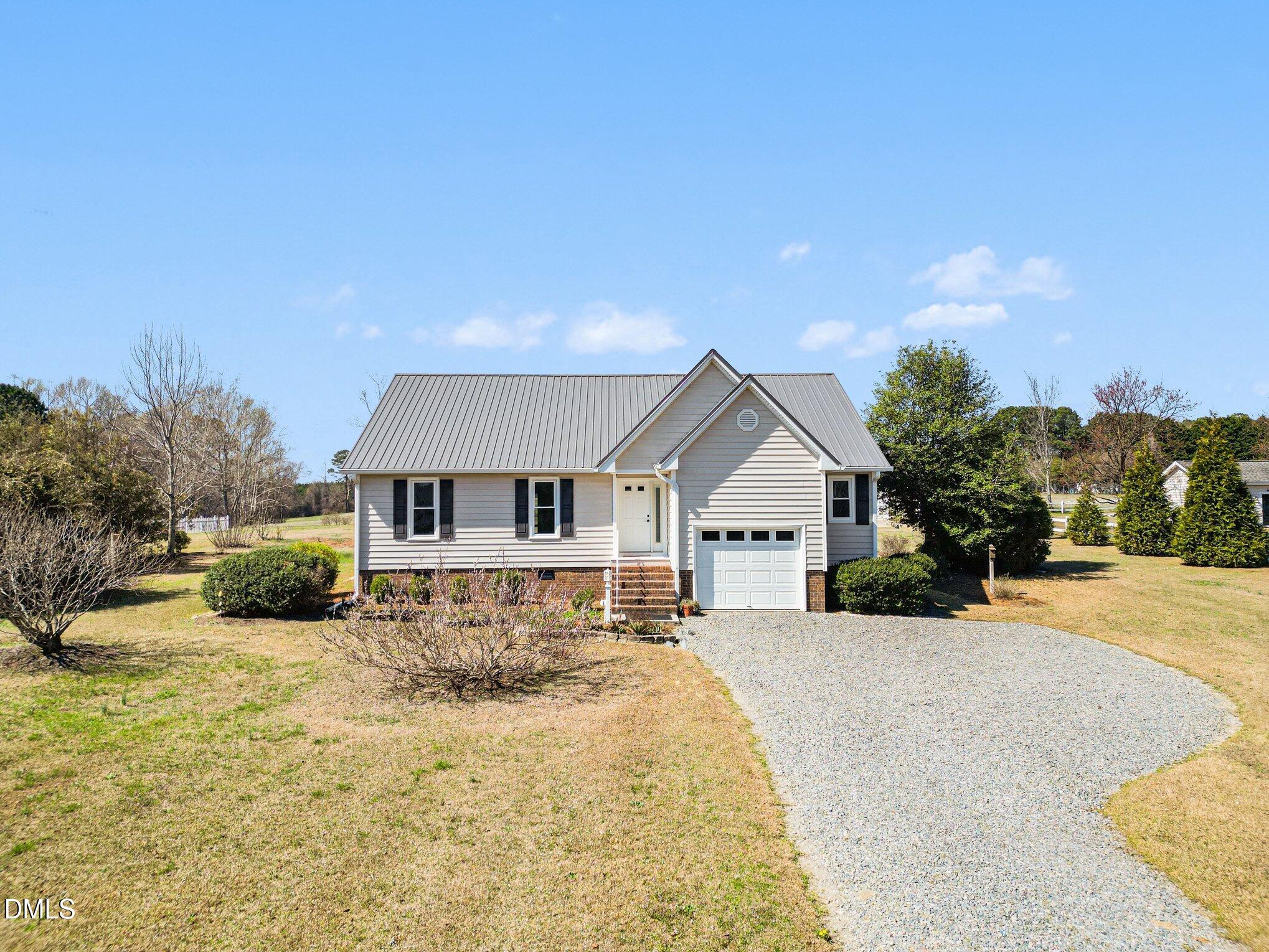 2004 Little Pond Place Willow Spring, NC 27592 - Photo 1 of 32 a view of a house with a yard