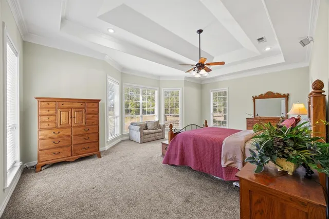 a bedroom with bed and a window