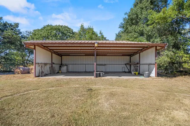 a view of a house with swimming pool and a yard