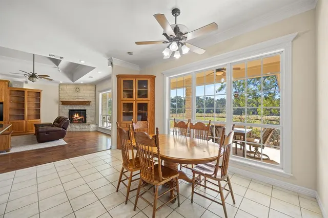 a view of a dining room with furniture window and outside view