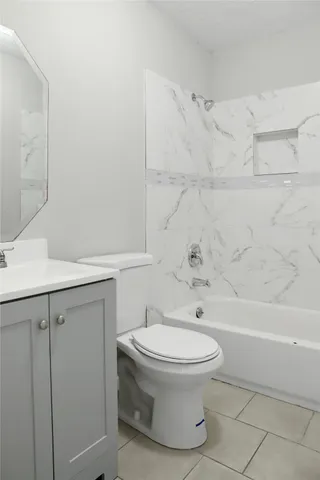 a bathroom with a toilet and a sink