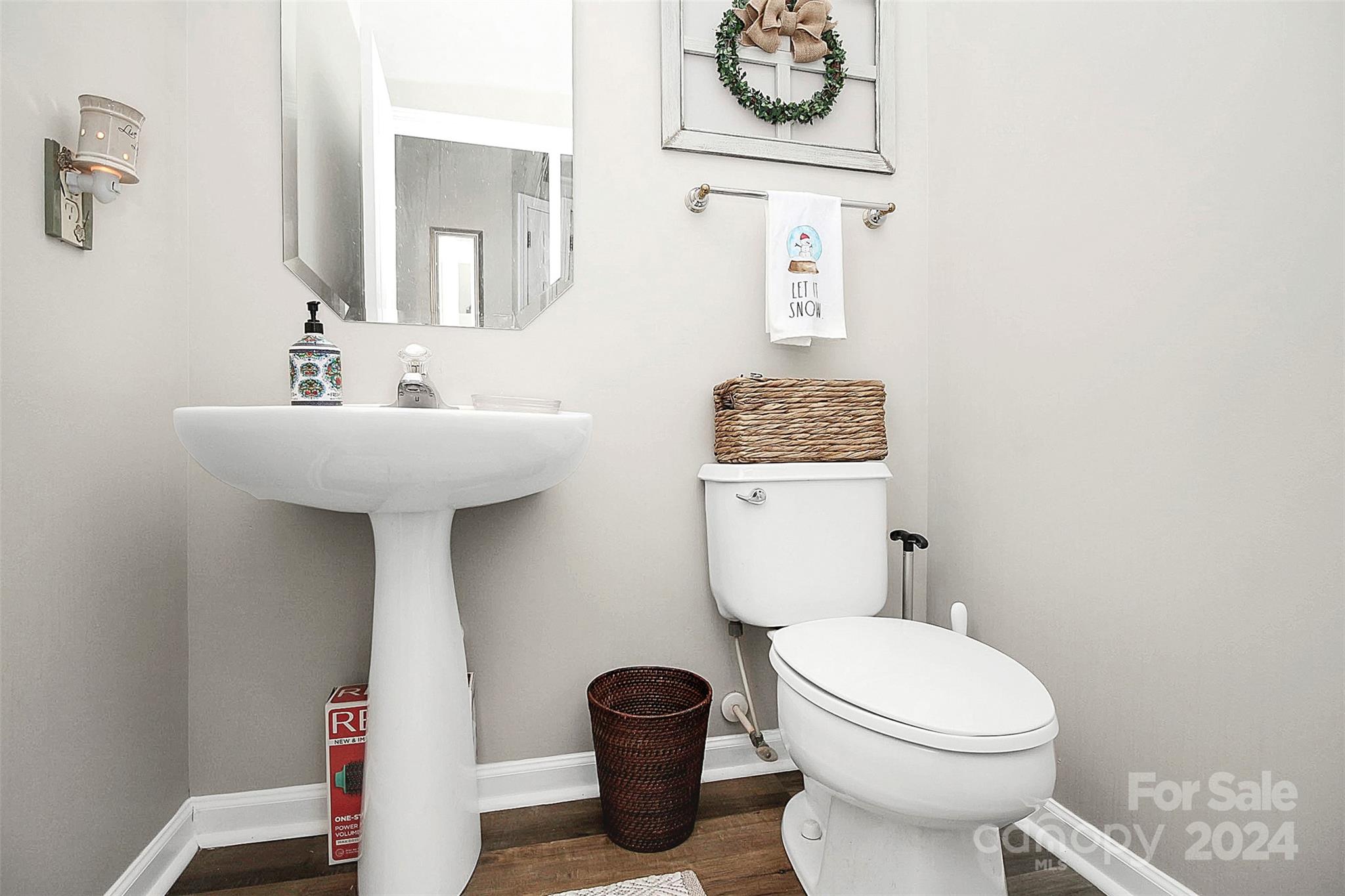 6730 Reedy Creek Road Charlotte, NC 28215 - Photo 17 of 32 a bathroom with a toilet a sink and a mirror