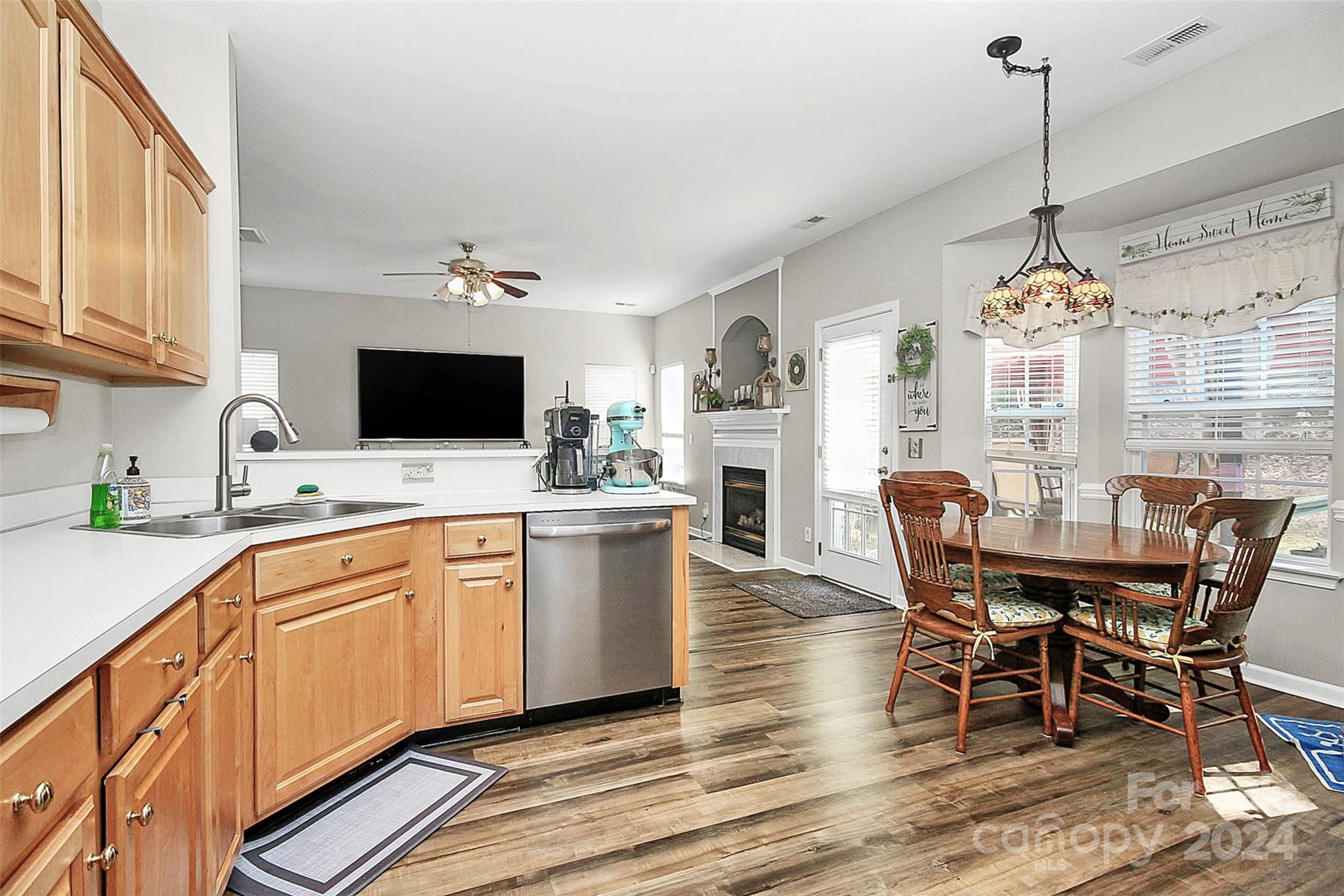 6730 Reedy Creek Road Charlotte, NC 28215 - Photo 3 of 32 a view of a dining room with furniture window and wooden floor