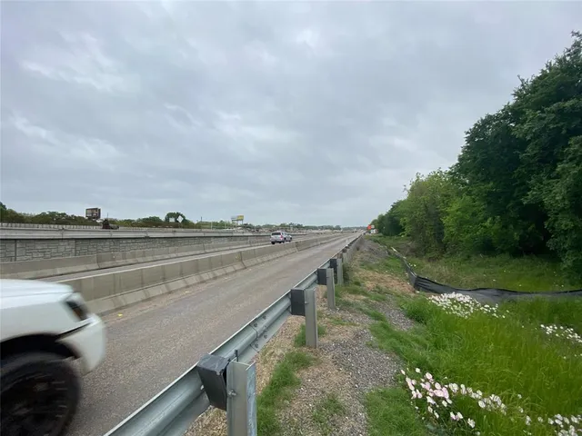 a view of swimming pool with a yard