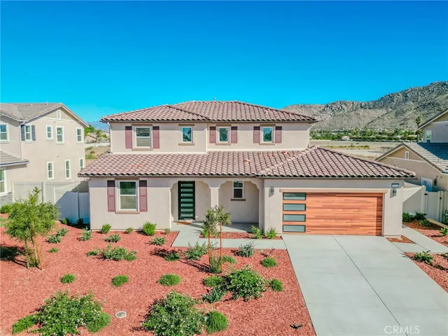 a front view of a house with a garage