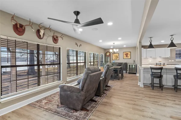 a kitchen with stainless steel appliances kitchen island granite countertop a sink and cabinets