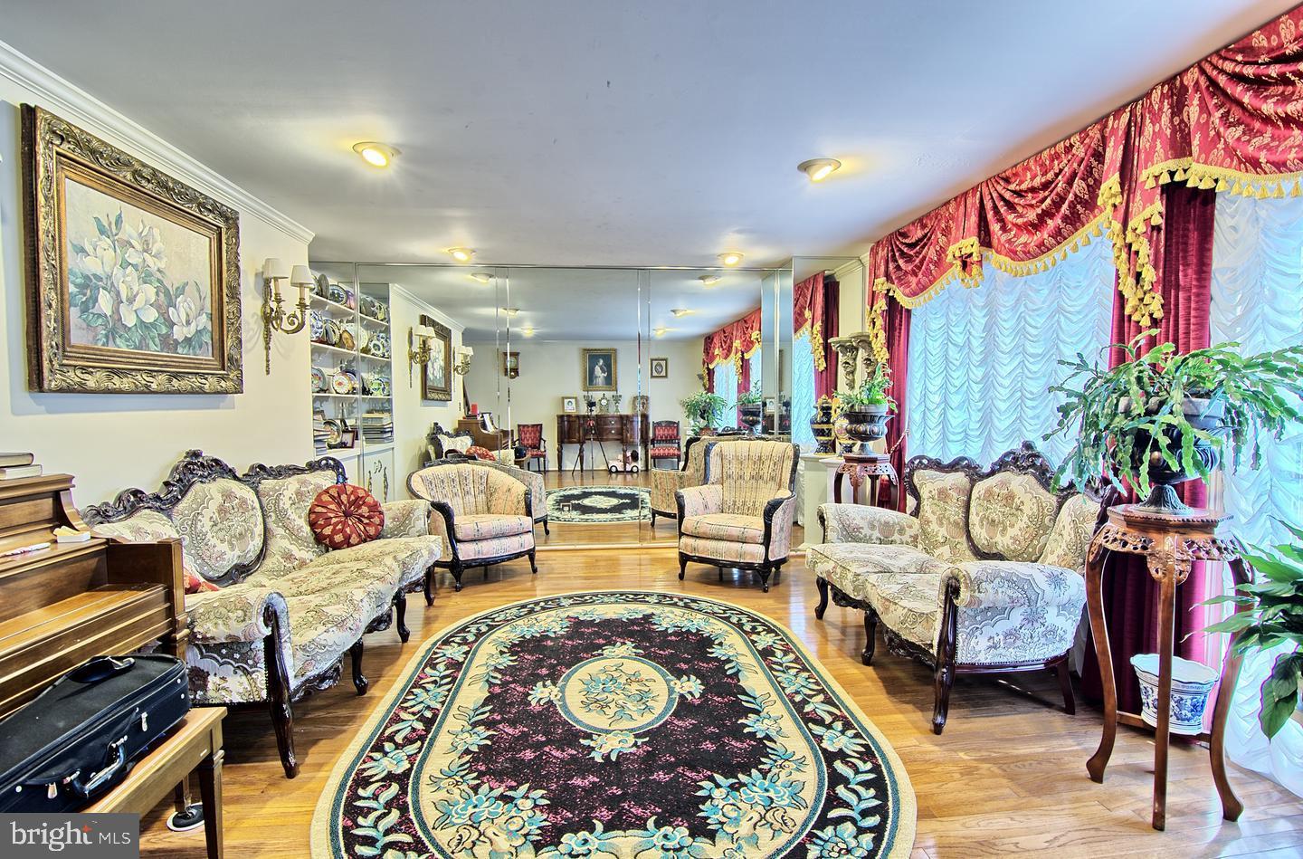55 Jones Valley Circle Baltimore, MD 21209 - Photo 3 of 22 Living Room with Hardwood Floor & Sliders to Deck