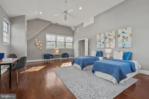 a living room with furniture a fireplace and a table
