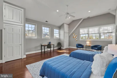 a view of a hallway with wooden floor windows and livingroom