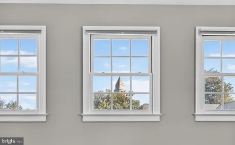 a view of balcony with furniture and wooden floor