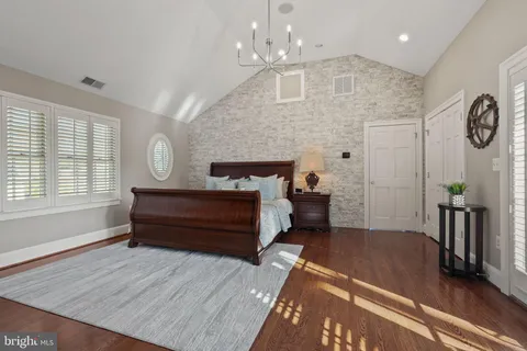a view of a table and chairs in backyard of the house