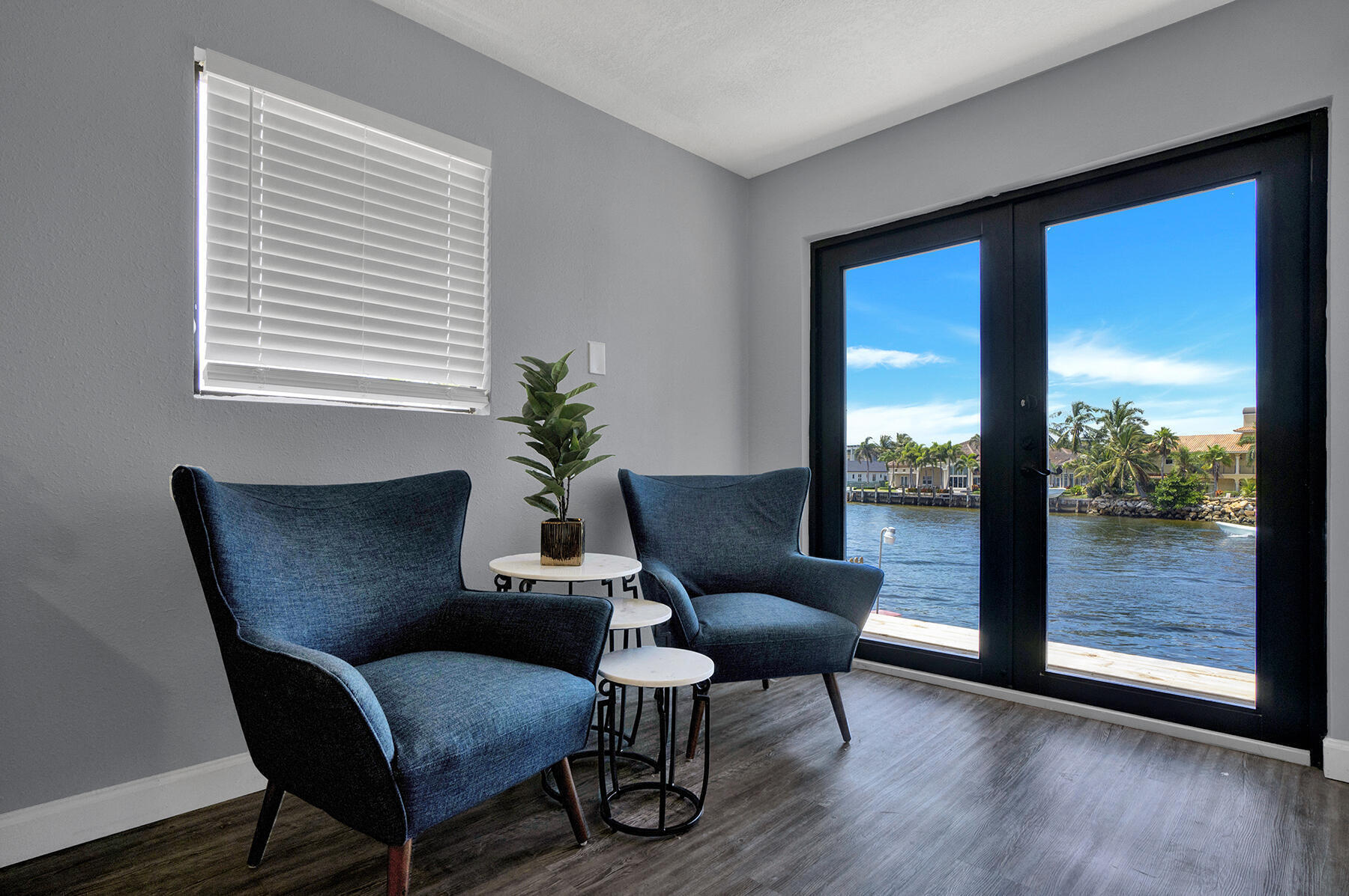 1901 North Riverside Drive, Unit 1 Pompano Beach, FL 33062 - Photo 16 of 26 a view of a livingroom with furniture wooden floor and a window
