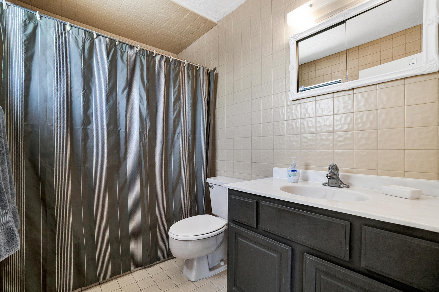 1901 North Riverside Drive, Unit 1 Pompano Beach, FL 33062 - Photo 20 of 26 a bathroom with a sink a toilet and shower
