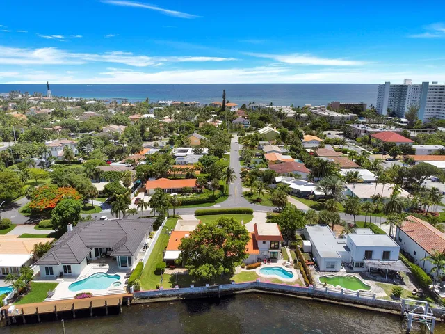 an aerial view of residential houses with city view