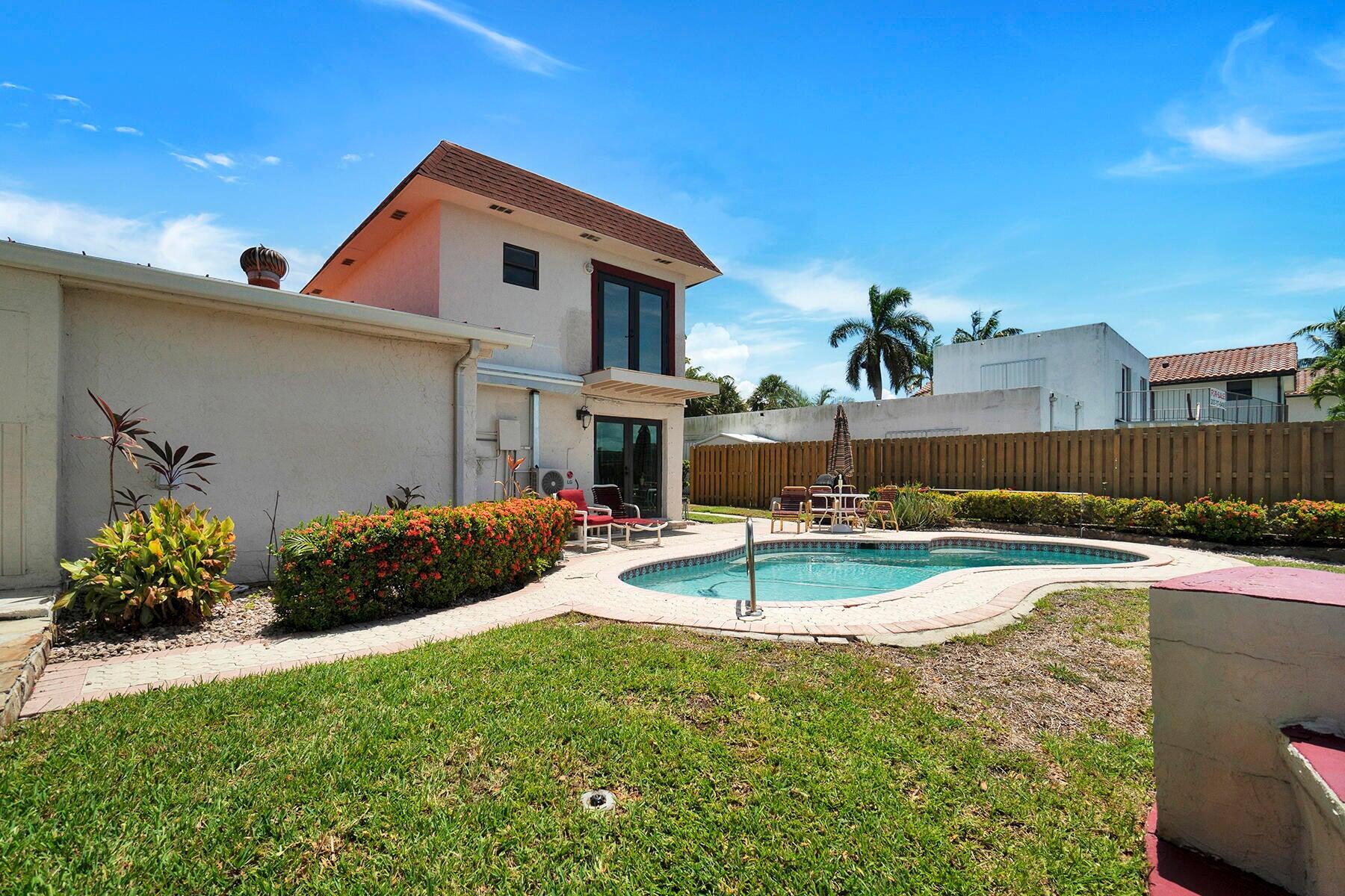 1901 North Riverside Drive, Unit 1 Pompano Beach, FL 33062 - Photo 6 of 26 a front view of a house with garden