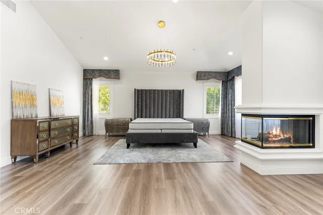 a room with a bed and a large window