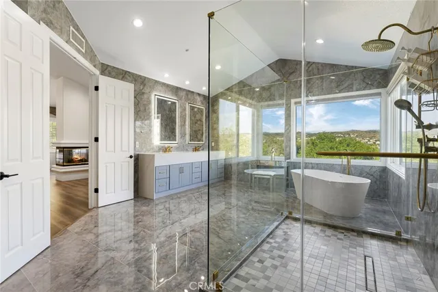 a bathroom with a granite countertop sink mirror and double