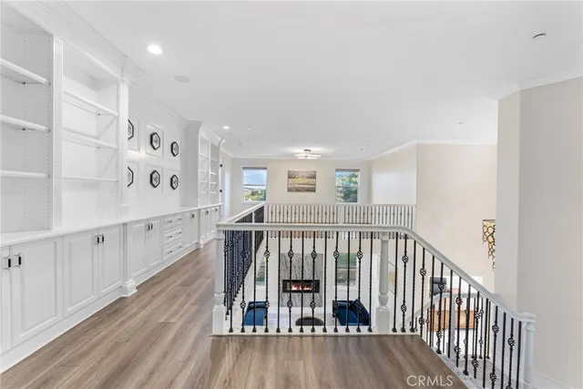 a view of a livingroom with furniture wooden floor and chandelier