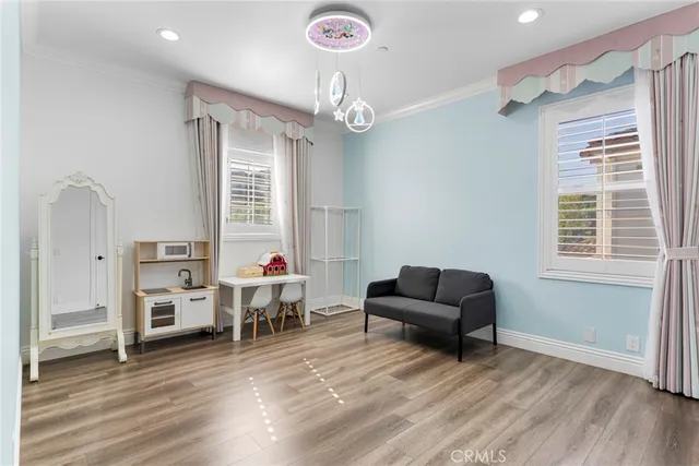 a spacious bedroom with a bed and a dresser