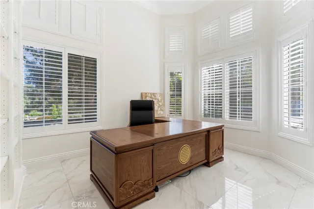 a view of a livingroom with furniture and windows