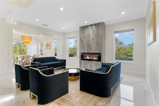 a view of a dining room with furniture and chandelier