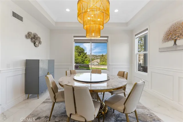 a kitchen with kitchen island granite countertop a stove and a sink
