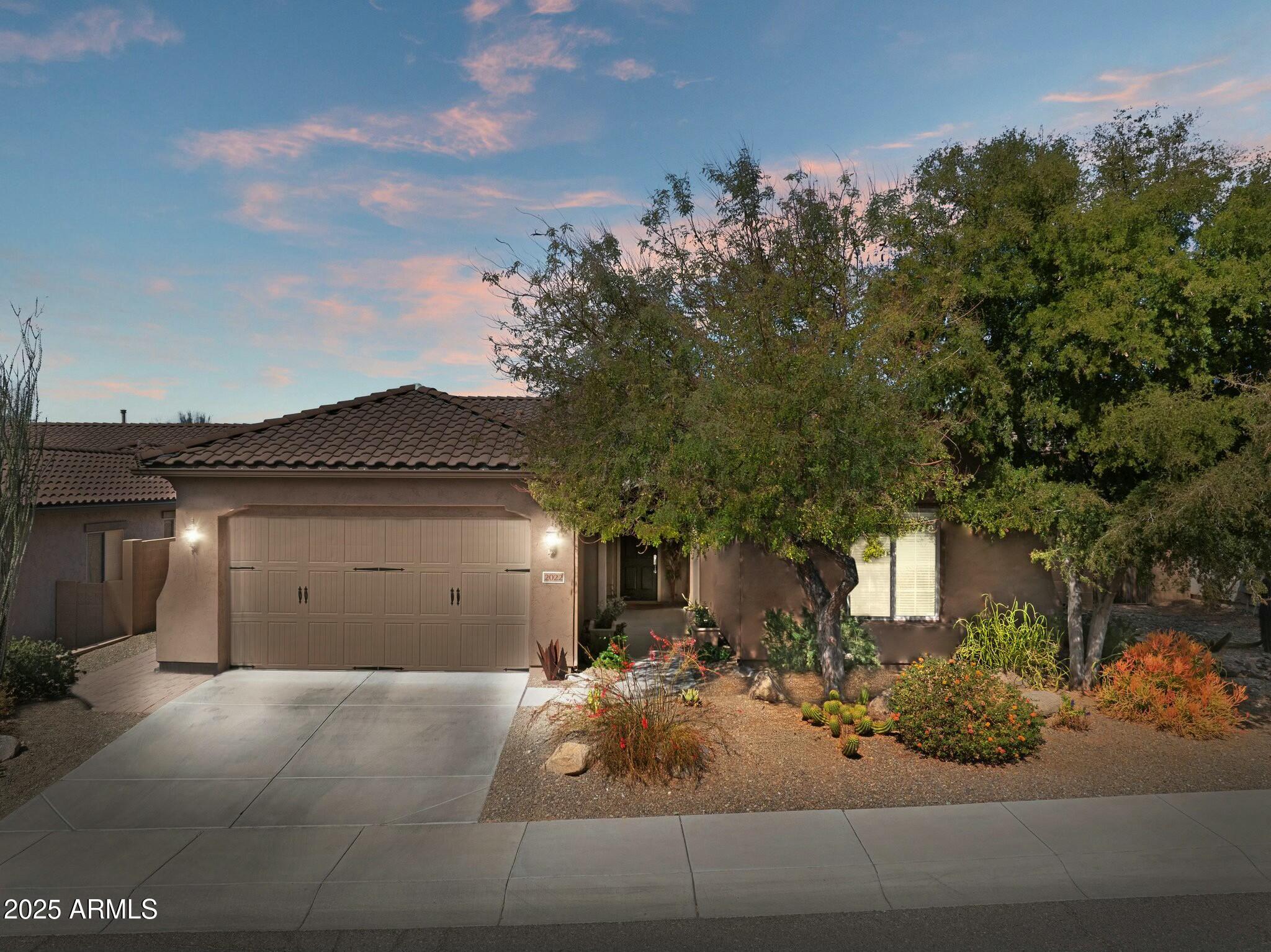 2022 West Steed Ridge Phoenix, AZ 85085 - Photo 1 of 85 a view of a house with a garage