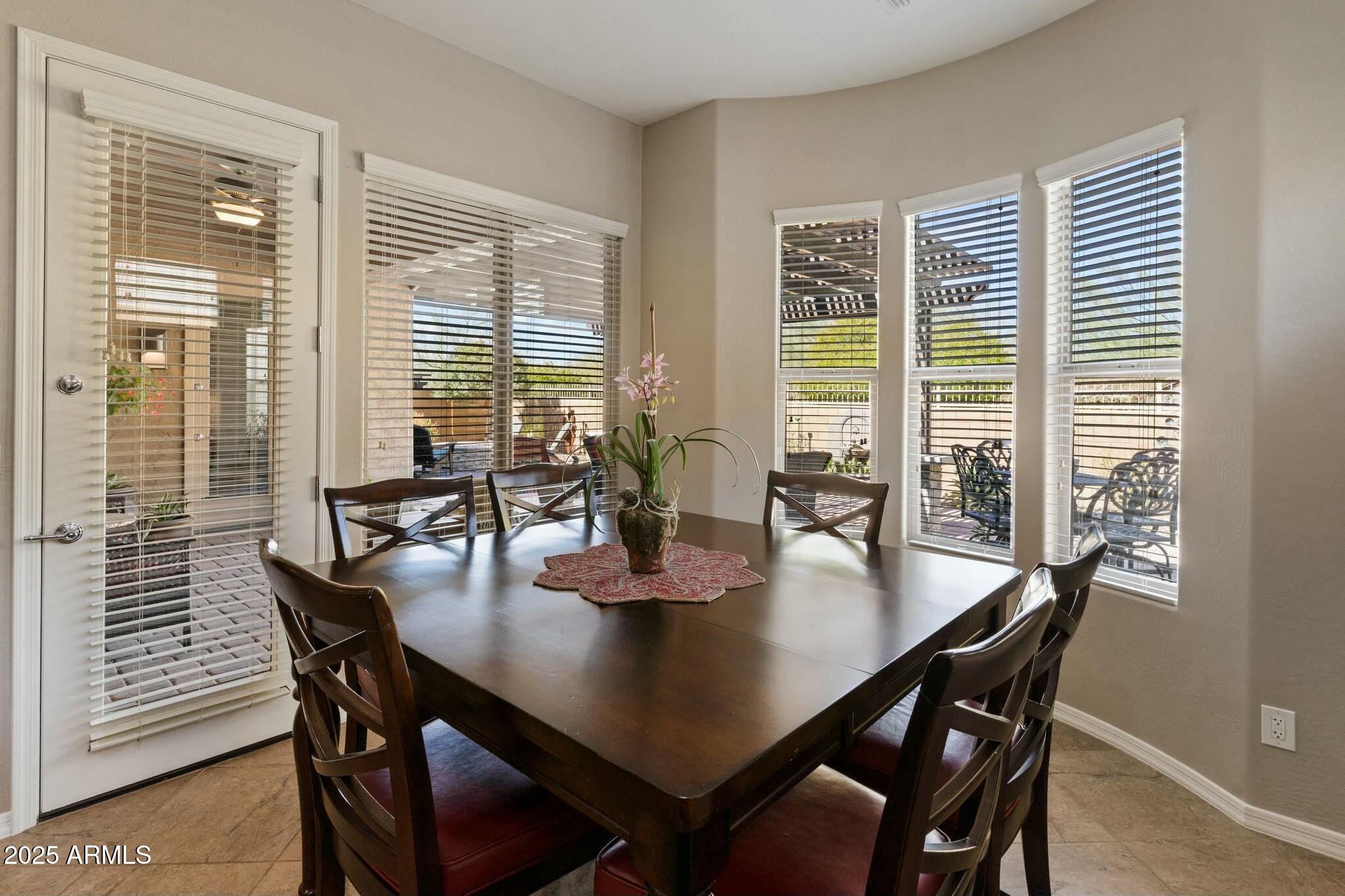 2022 West Steed Ridge Phoenix, AZ 85085 - Photo 14 of 85 a dining room with furniture and wooden floor