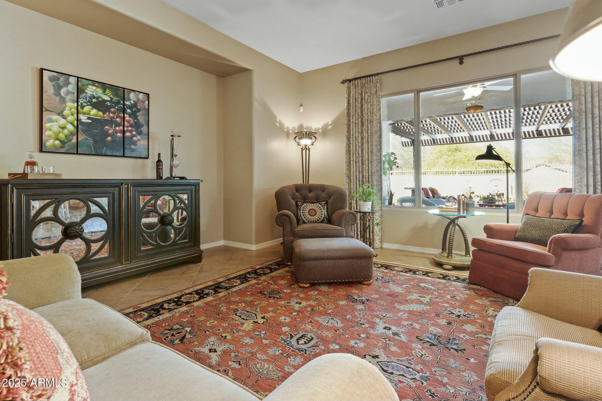 2022 West Steed Ridge Phoenix, AZ 85085 - Photo 17 of 85 a living room with furniture and a floor to ceiling window