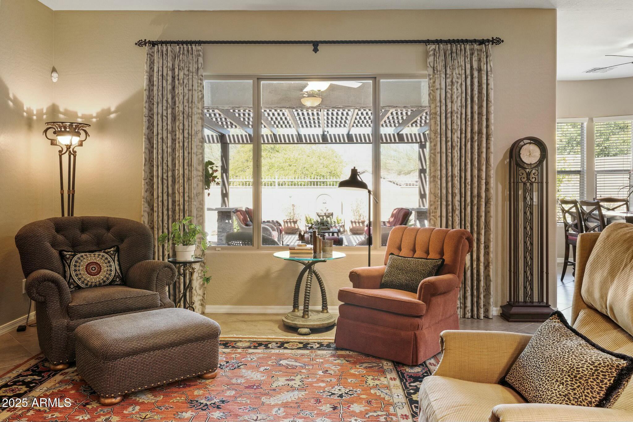 2022 West Steed Ridge Phoenix, AZ 85085 - Photo 18 of 85 a living room with furniture and a large window
