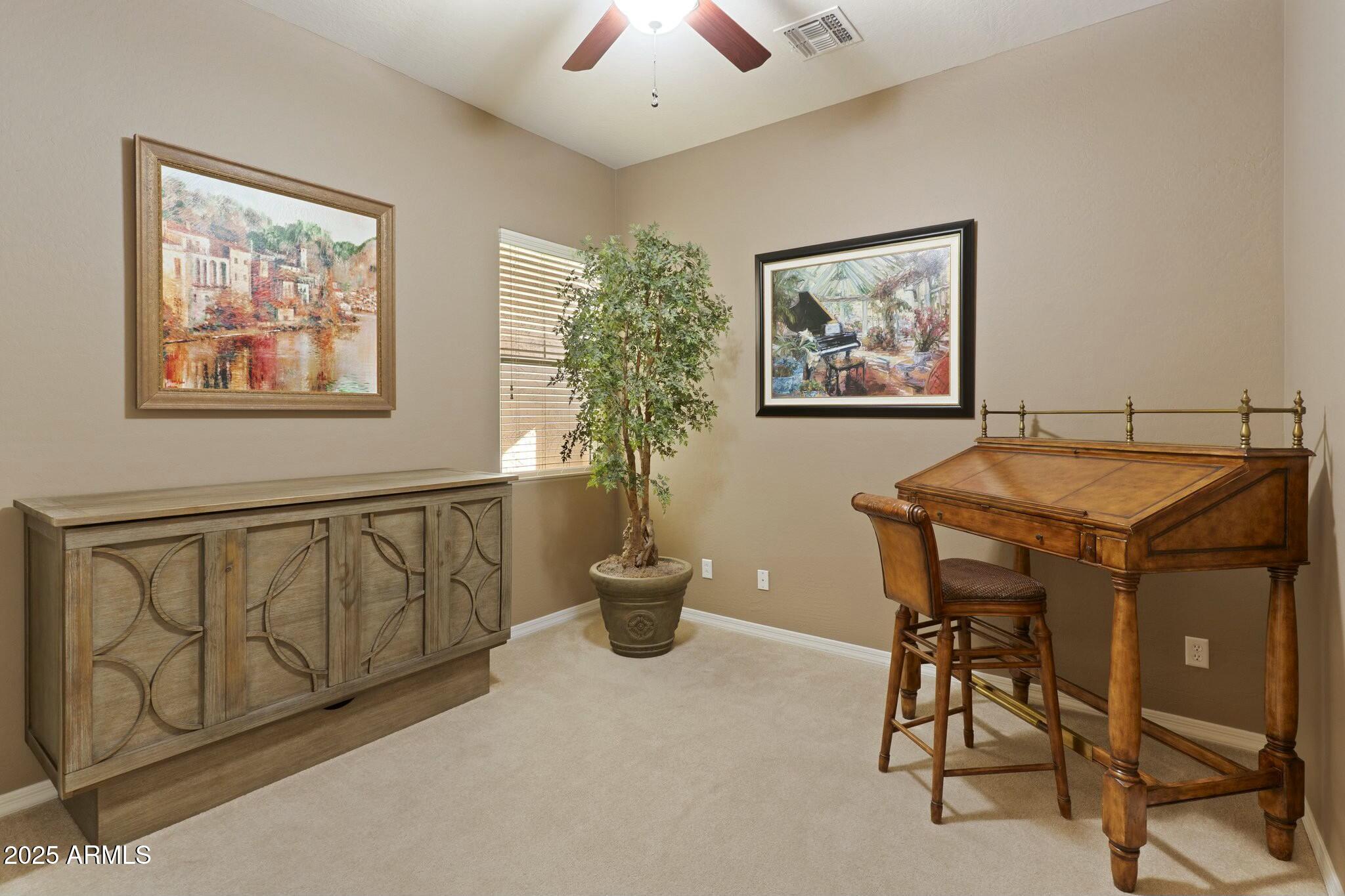 2022 West Steed Ridge Phoenix, AZ 85085 - Photo 32 of 85 a view of a dining room with furniture and chandelier