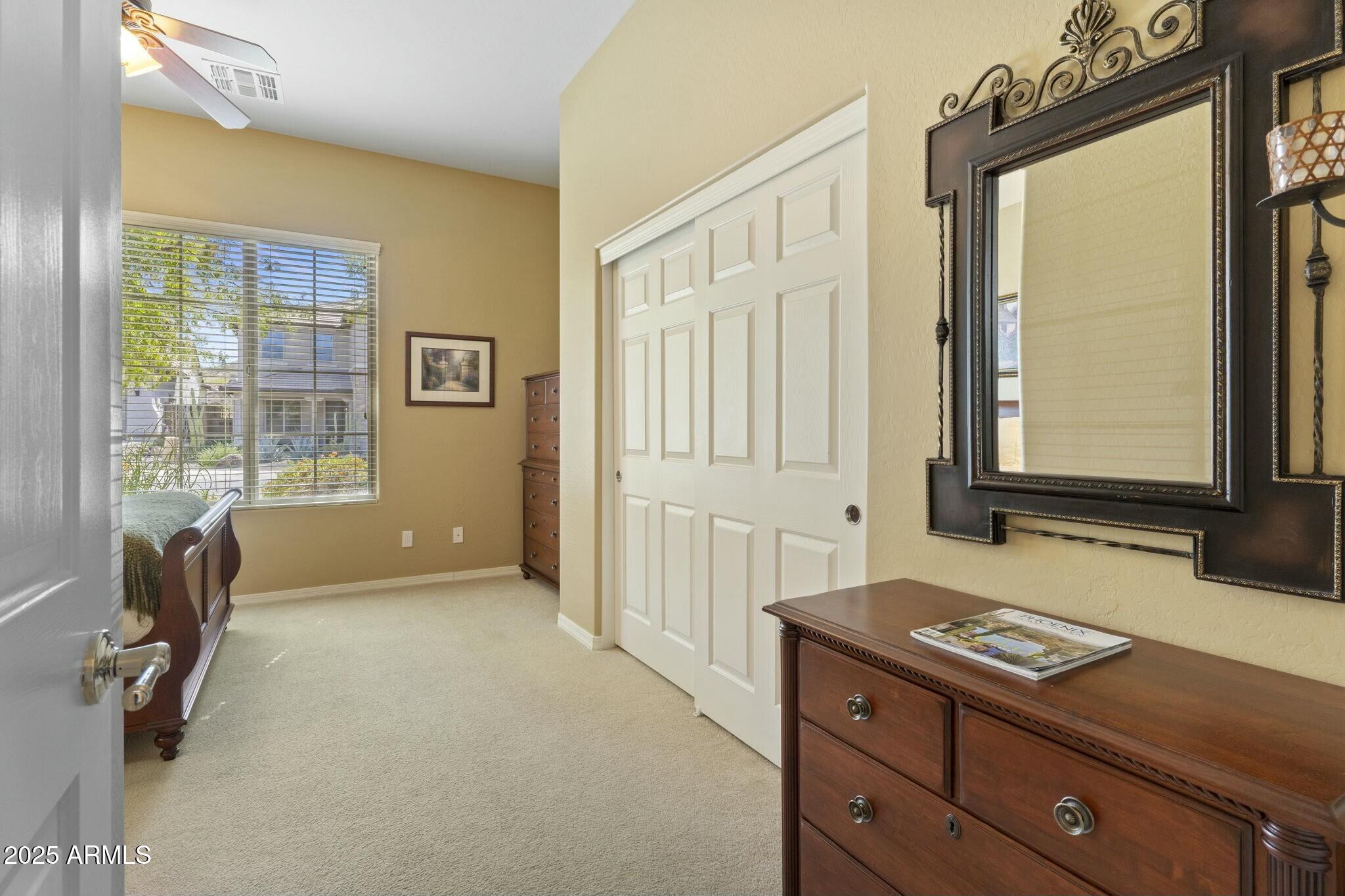 2022 West Steed Ridge Phoenix, AZ 85085 - Photo 41 of 85 a living room with a bed furniture and a window