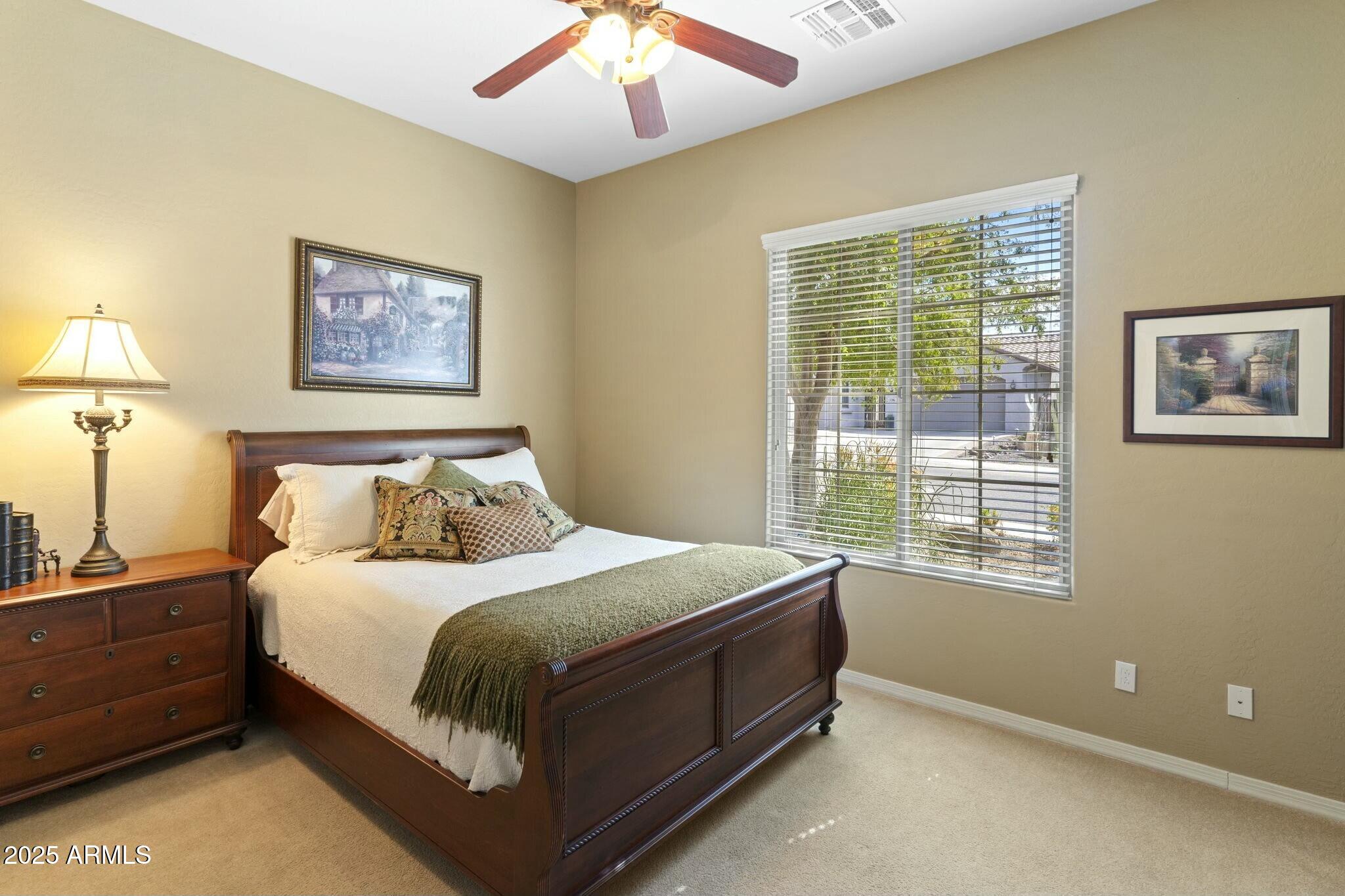 2022 West Steed Ridge Phoenix, AZ 85085 - Photo 42 of 85 a bedroom with a bed and a window