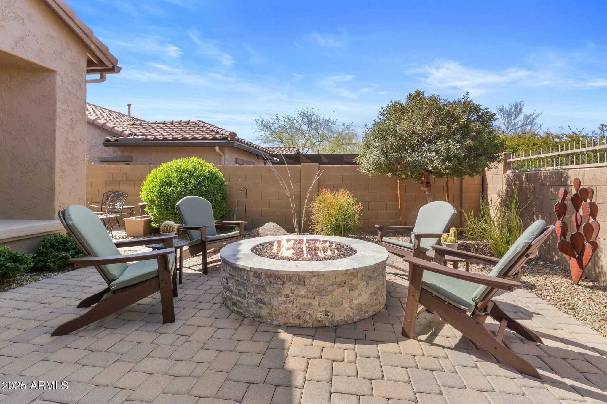 2022 West Steed Ridge Phoenix, AZ 85085 - Photo 50 of 85 a patio with table and chairs