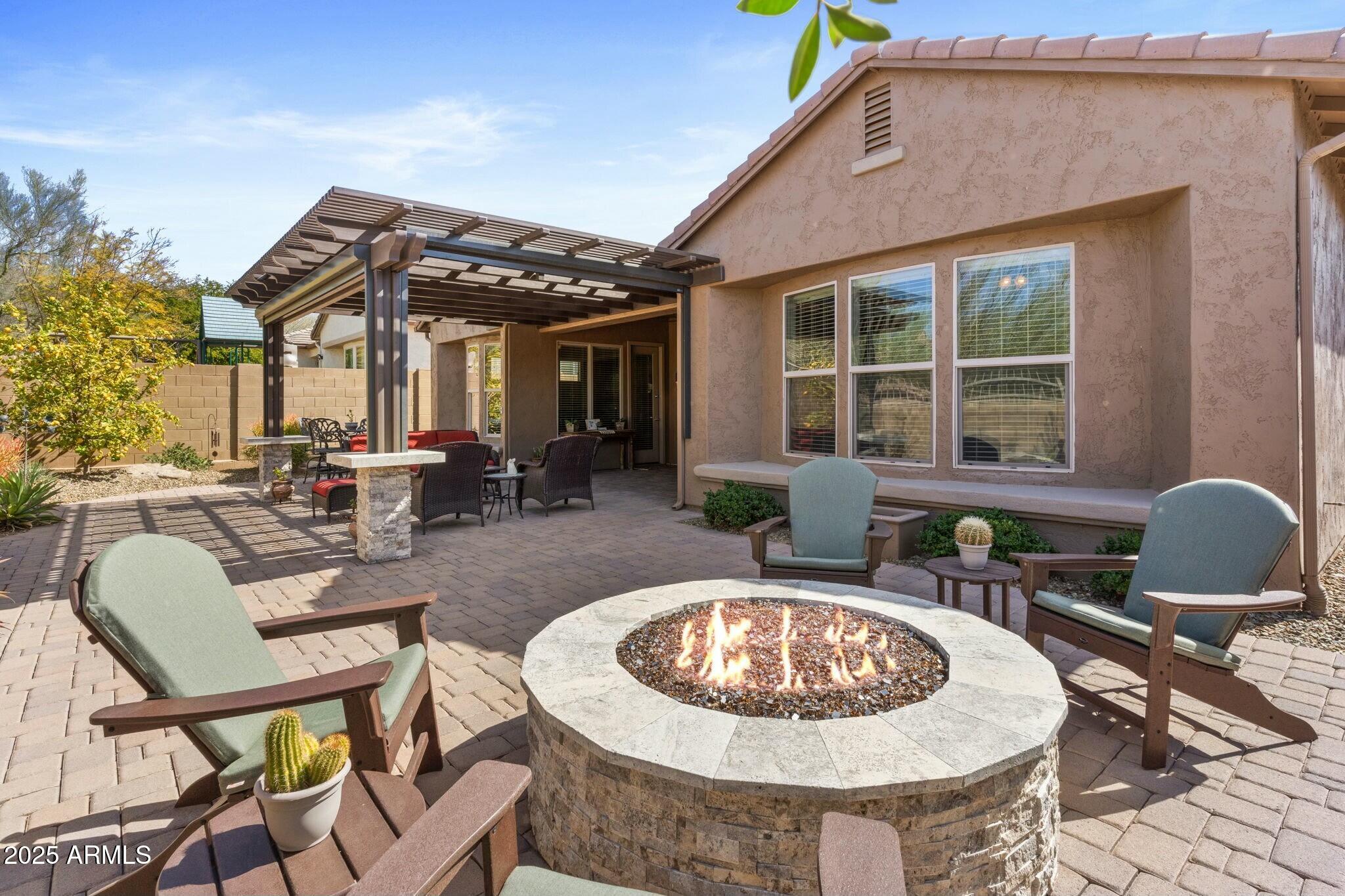 2022 West Steed Ridge Phoenix, AZ 85085 - Photo 5 of 85 a view of a house with swimming pool and furniture