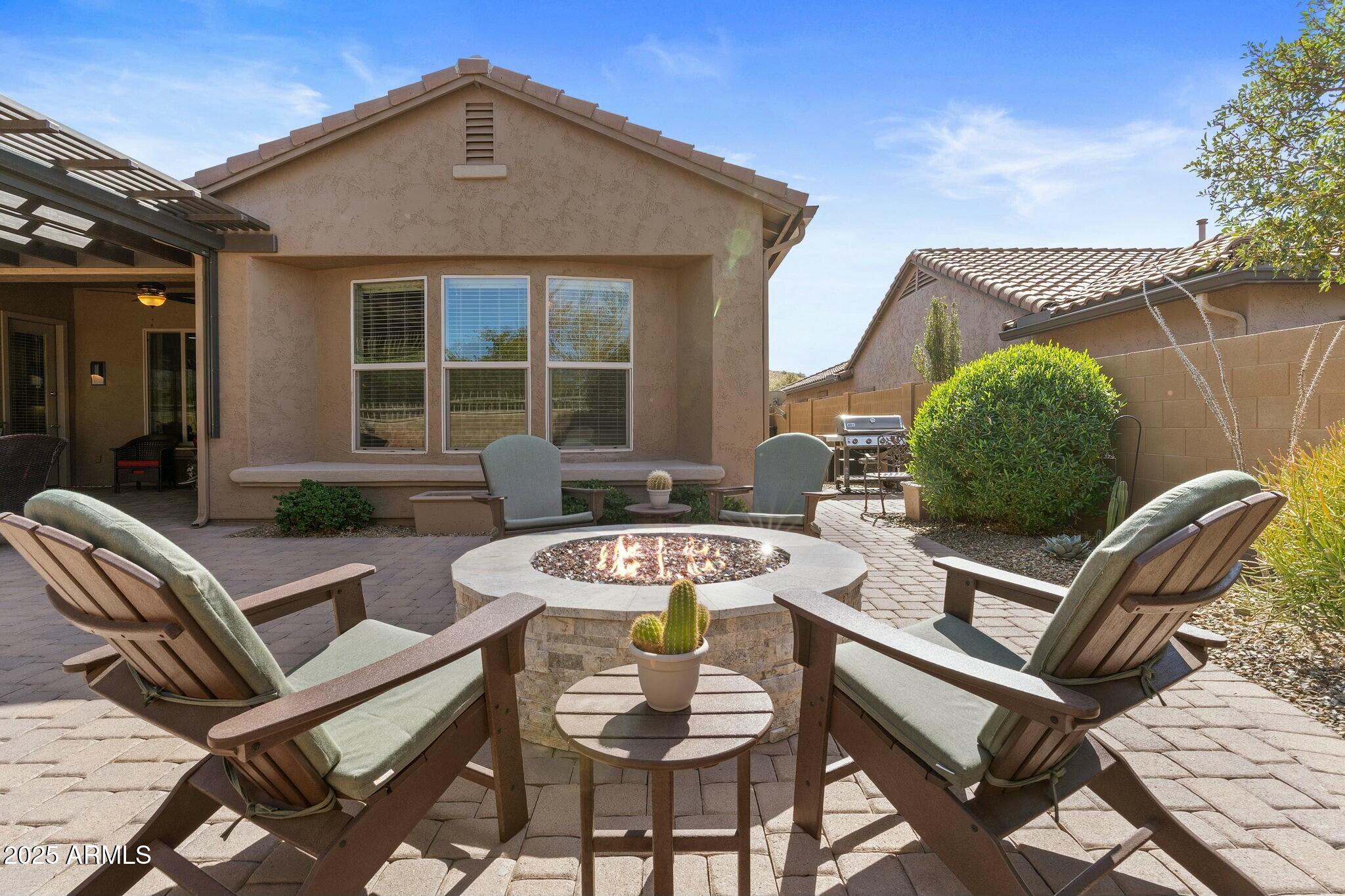 2022 West Steed Ridge Phoenix, AZ 85085 - Photo 51 of 85 a view of a patio with table and chairs and potted plants