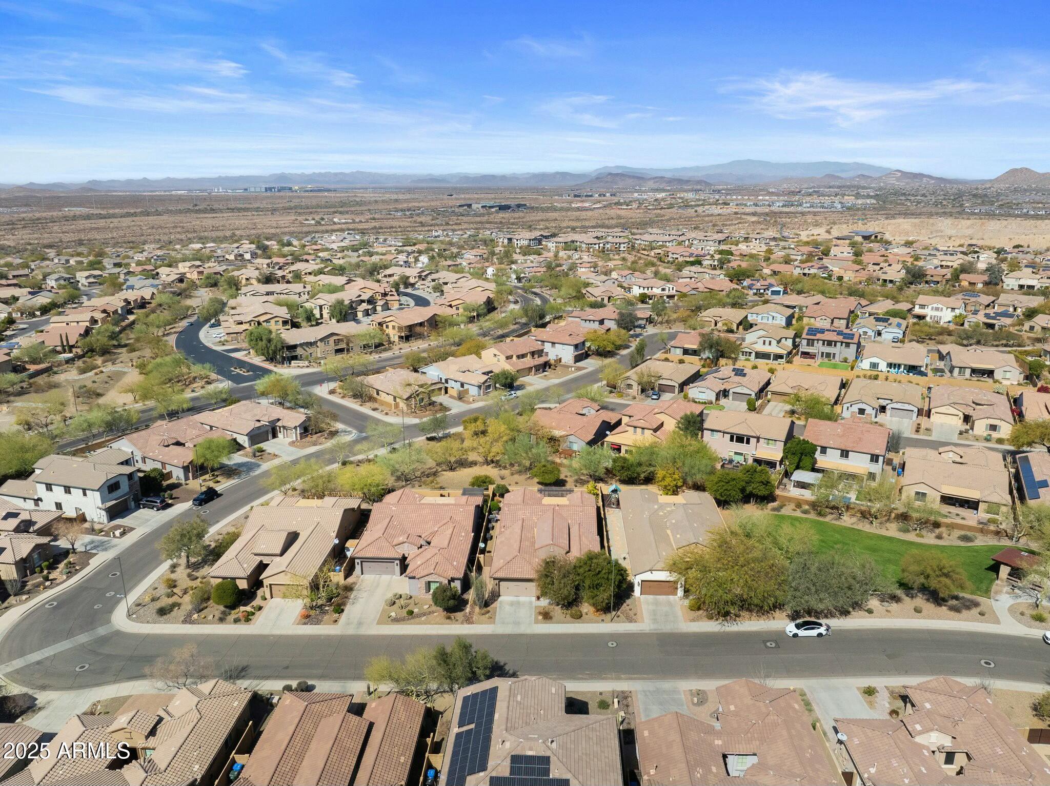 2022 West Steed Ridge Phoenix, AZ 85085 - Photo 56 of 85 an aerial view of residential houses with outdoor space