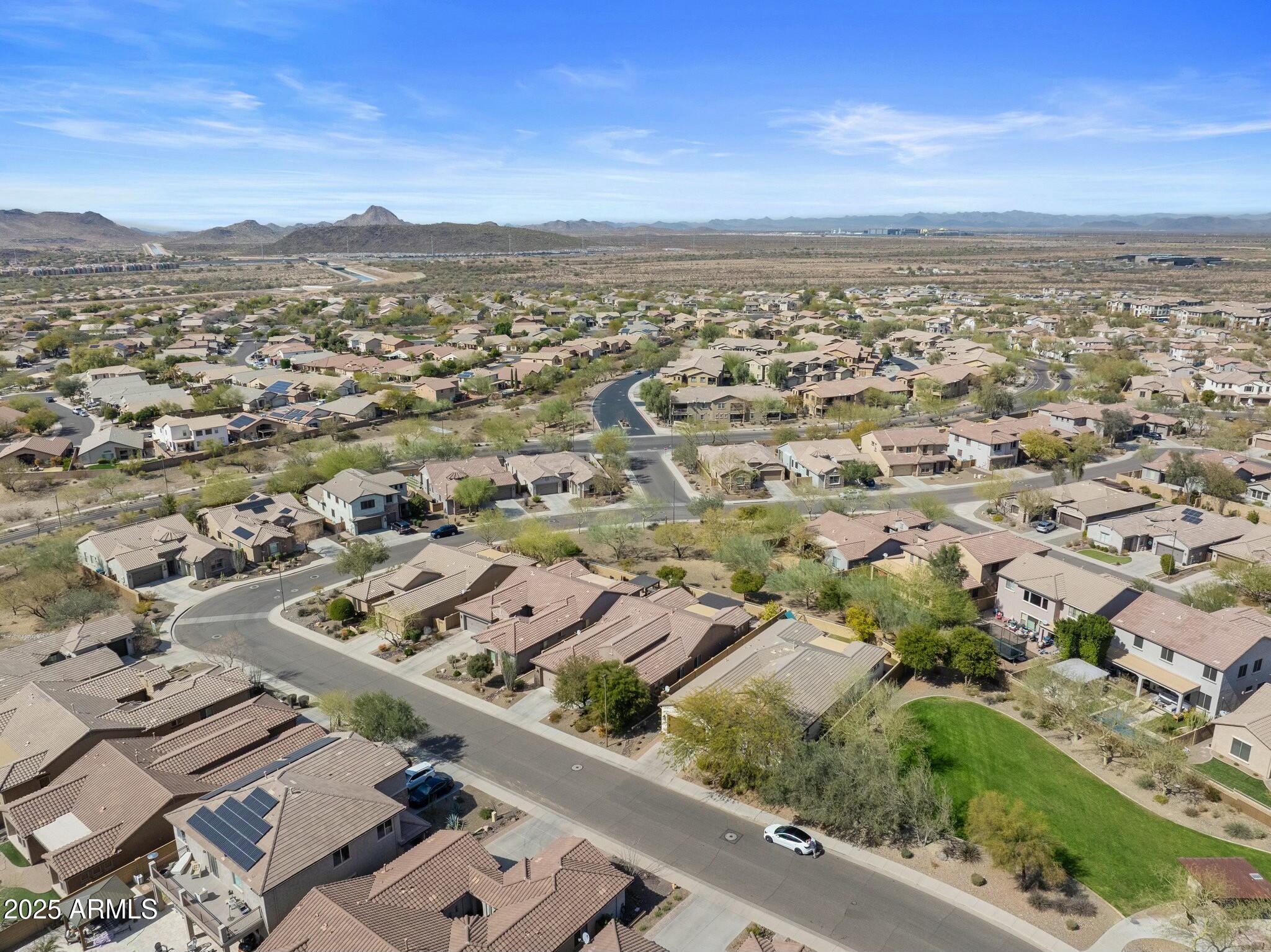 2022 West Steed Ridge Phoenix, AZ 85085 - Photo 57 of 85 an aerial view of residential building with parking space