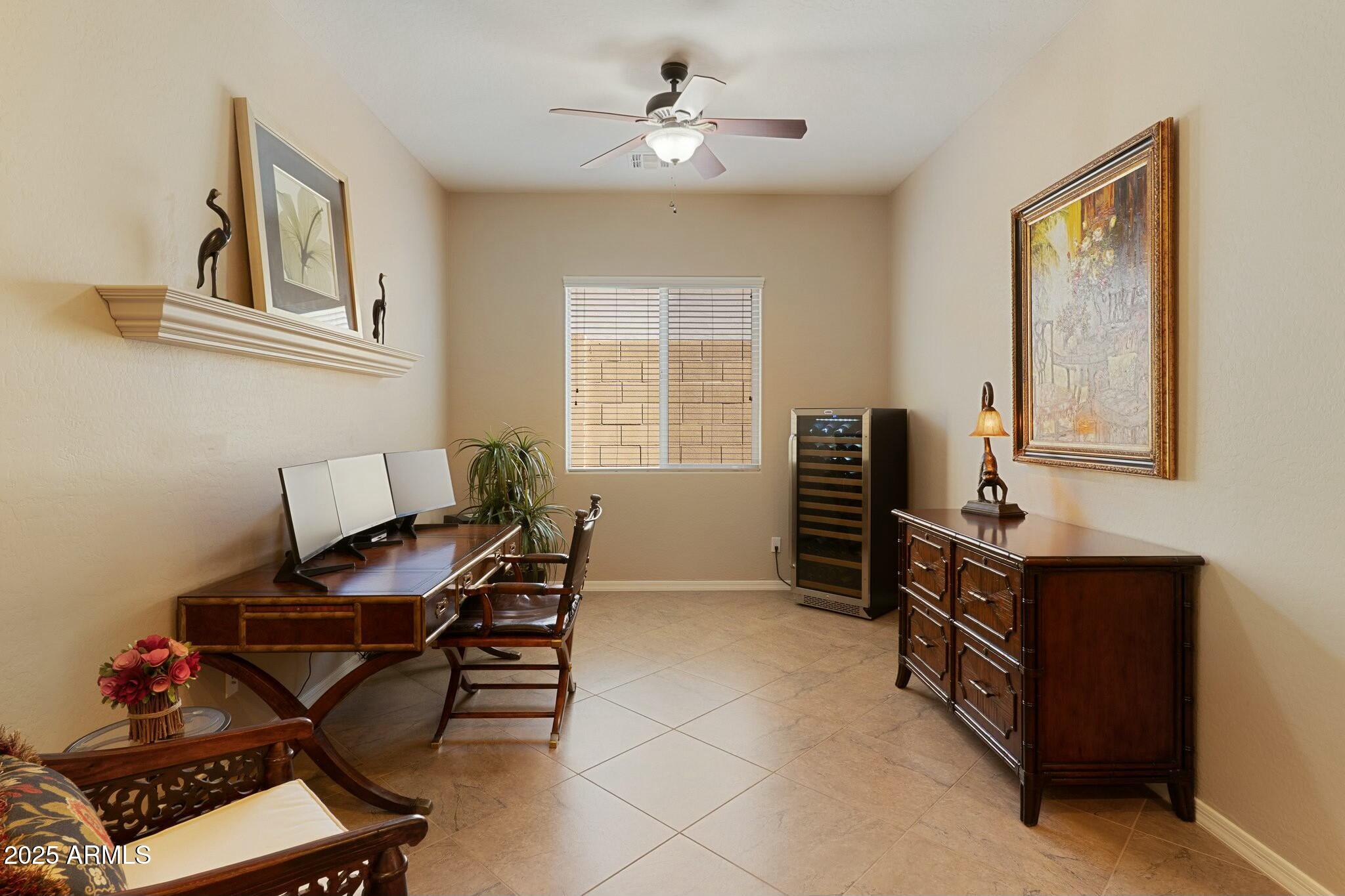 2022 West Steed Ridge Phoenix, AZ 85085 - Photo 9 of 85 a view of a workspace with furniture and a window