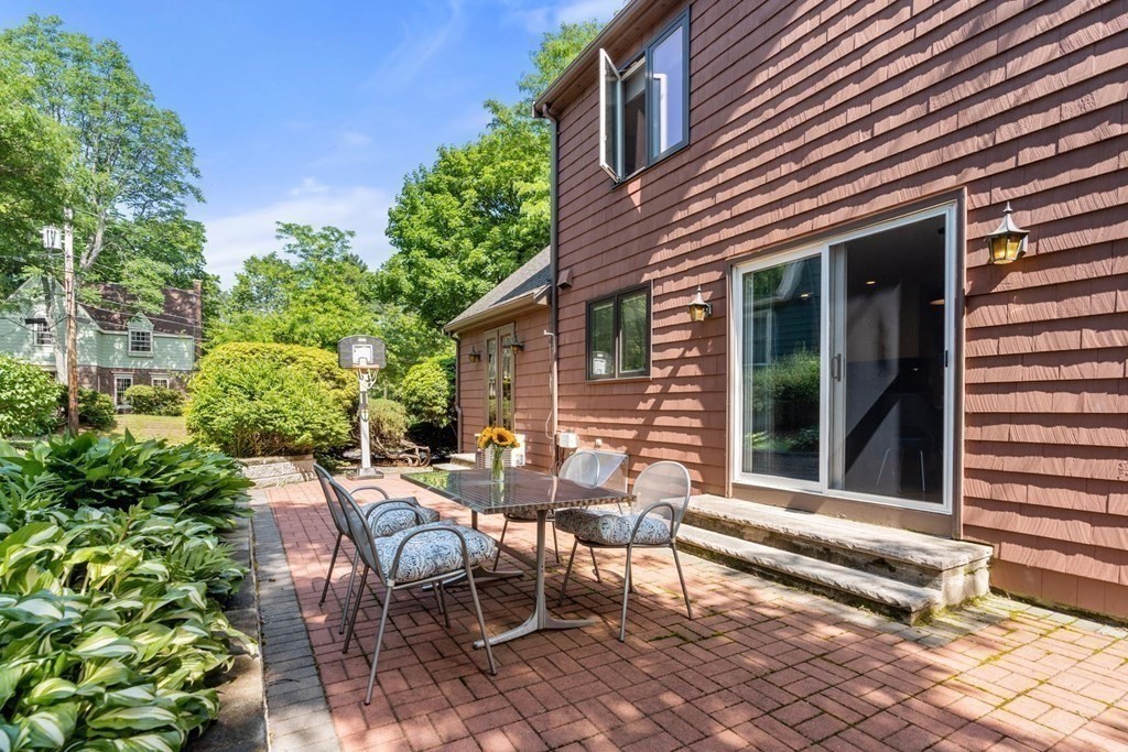 95 Wood End Road Newton, MA 02461 - Photo 13 of 28 a view of a patio with table and chairs and potted plants