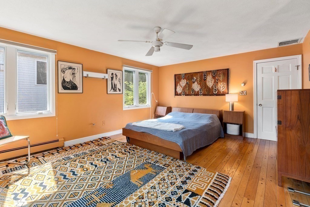 95 Wood End Road Newton, MA 02461 - Photo 16 of 28 a bedroom with a bed and wooden floor