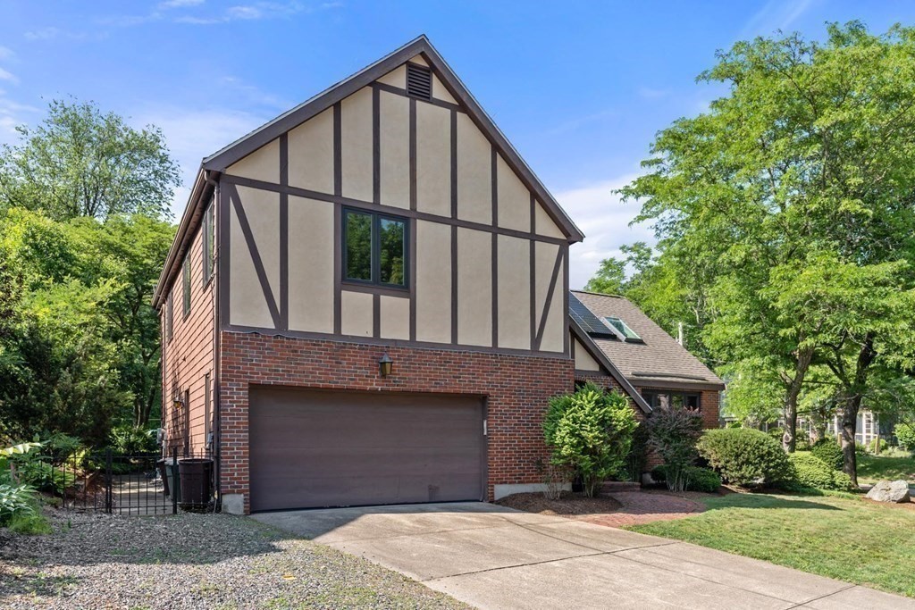 95 Wood End Road Newton, MA 02461 - Photo 25 of 28 a front view of a house with a yard