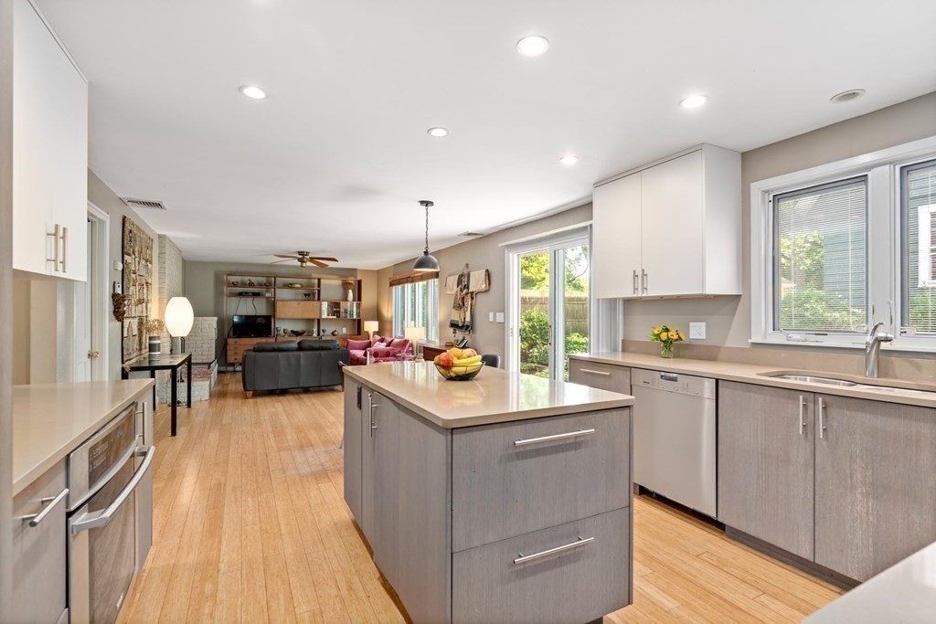 95 Wood End Road Newton, MA 02461 - Photo 8 of 28 a kitchen with a sink stove and cabinets
