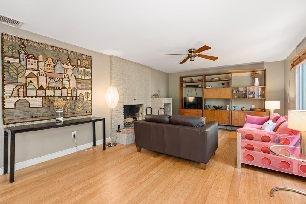 95 Wood End Road Newton, MA 02461 - Photo 9 of 28 a living room with furniture and a wooden floor