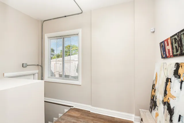a view of storage and utility room with a window